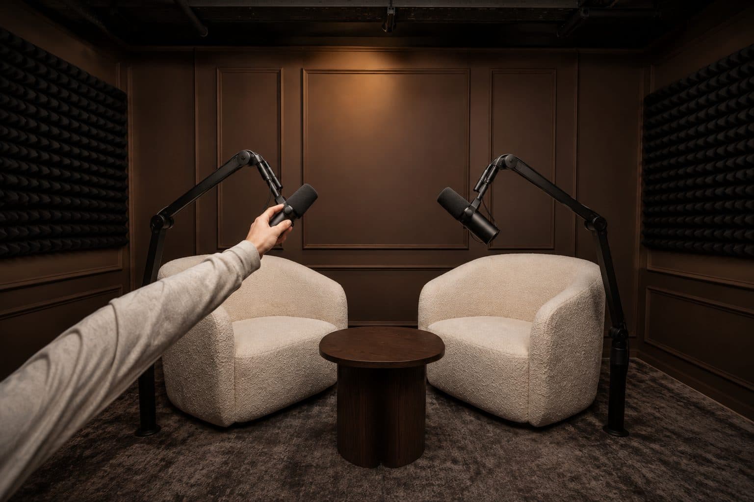 Podcast set with two microphones being adjusted before a session